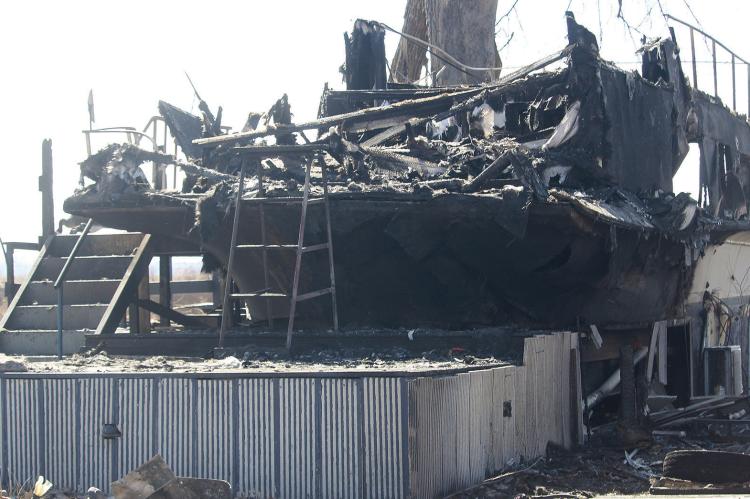 STRUCTURAL DAMAGE remains visible in the Sunshine Lake area after multiple agencies responded to a fast-moving fire. MIRANDA JAMISON | Staff