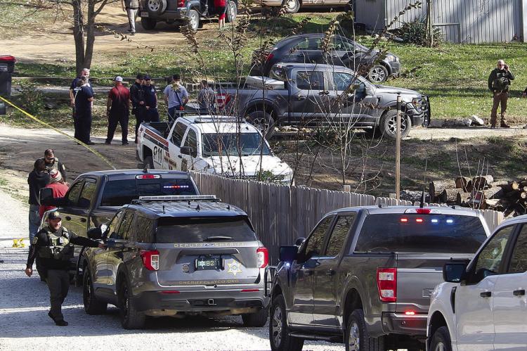 DEPUTIES CONTROL ACCESS to Arapahoe Drive while first responders continue processing the scene. MIRANDA JAMISON | Staff