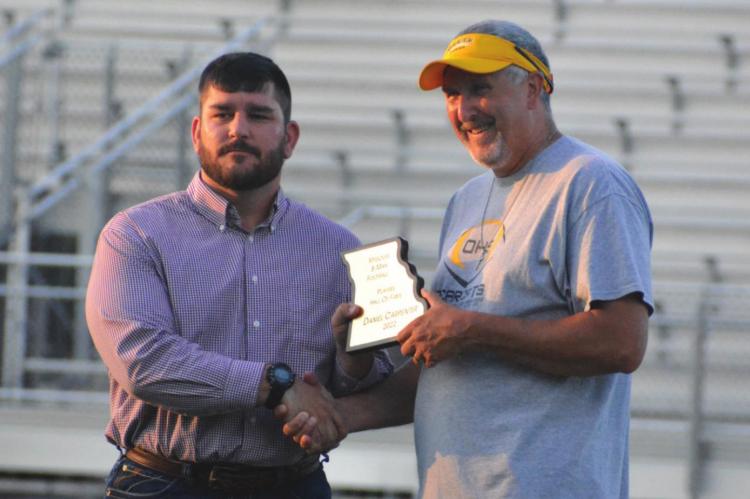 HARDIN-CENTRAL grad Dan Carpenter, left, receives his Missouri 8-Man Football Hall of Fame commemorative plaque from coach Kirk Thacker. SHAWN RONEY | Staff