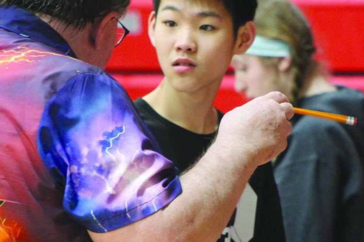 AIDEN YAN works through spending decisions during Richmond Middle School’s first-ever Reality Fair. SHARON DONAT | Staff