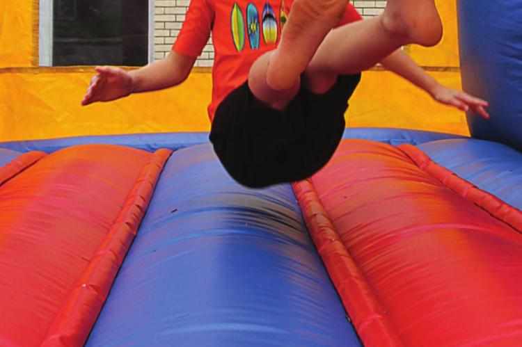 AMONG THE ACTIVITIES for Hardin's 150th anniversayr celebration is a bounce house, which gets a workout from Jensen Finley, 8.