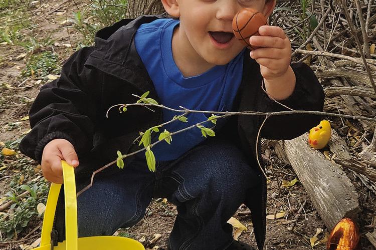 WITH THE HELP of his family, Mavryk Teegarden finds a special egg at Bumble Bee Daycare. MIRANDA JAMISON | Staff