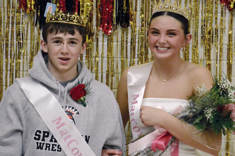 LOGAN MOYER (left) and Emma Hash are Richmond’s 2026 matcourtwarming royalty. Moyer was crowned king and Hash was crowned queen between the varsity girls and boys basketball games with Lexington, when the members of their matcourtwarming court also were presented. SHAWN RONEY | Staff