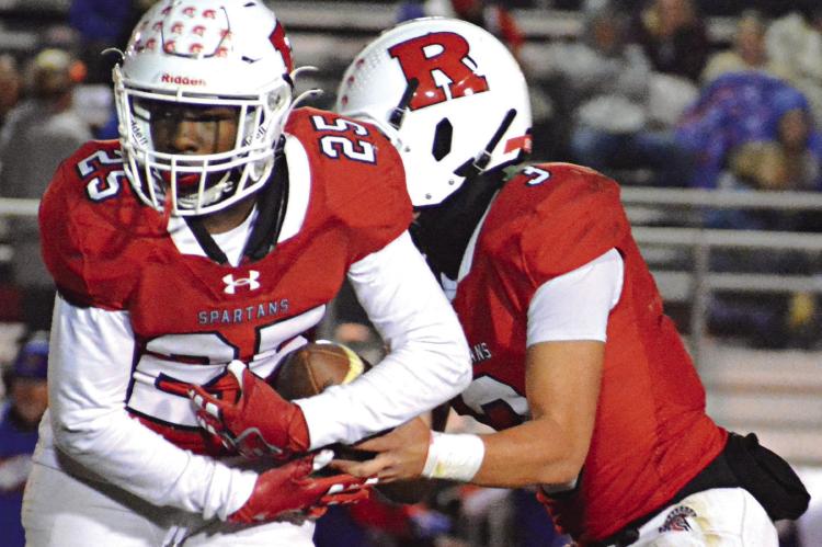 SAVION WEBB (left) and Jayden Pearson get reps on offense during Richmond’s Bell Game rout of archrival Lexington. SHAWN RONEY | Staff