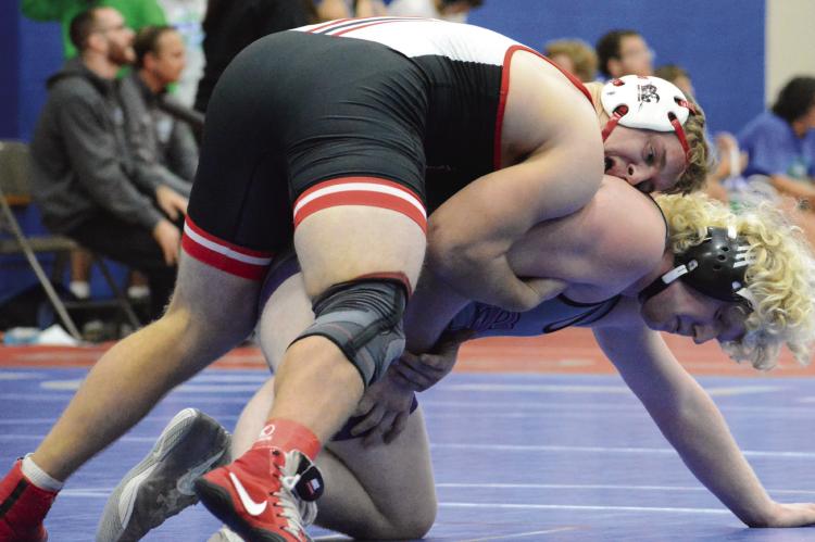 WRESTLING IN the upper position, Richmond senior Aidan Ivison works to break down South Harrison’s Mayson Edwards in Tom Hayes Dual Tournament action Dec. 10 at Lexington Middle School. SHAWN RONEY | Staff