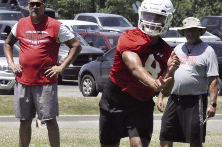KEYSHAUN ELLIOTT, shown passing during 7-on-7 scrimmaging in July 2019 as part of his duties as Richmond’s varsity quarterback, will soon appear in his second straight bowl game with New Mexico State University. However, he’ll play on defense when the Aggies face Fresno (Calif.) State University Dec. 16 in the New Mexico Bowl SHAWN RONEY | Staff