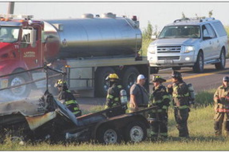 WOOD HEIGHTS, Excelsior Springs and Lawson Fire Departments work together to extinguish flames on the burning vehicles after a fatal head-on collision. MIRANDA JAMISON | Staff