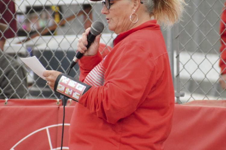 RICHMOND COACH Staci Maddux honors her seniors Sept. 22 at Southview Park.