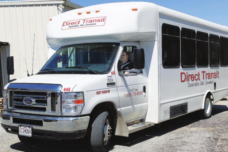HALF-A-DOZEN people in the Direct Transit bus driven by Sid Lewis are in line for food at the Salvation Army Family Store in Richmond. J.C. VENTIMIGLIA | Staff