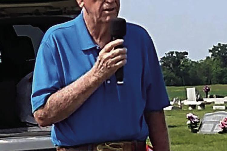 STEPHEN SHIRLEY LEADS the Memorial Day service at Hardin Cemetery.