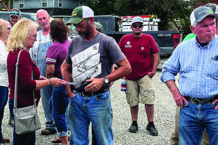 HARDIN RESIDENTS Joan (left) and Stan Utley (center) are two of many concerned about State Hwy A. The Hardin community discussed the highway topic with a MoDOT representative last week. SOPHIA BALES | Staff