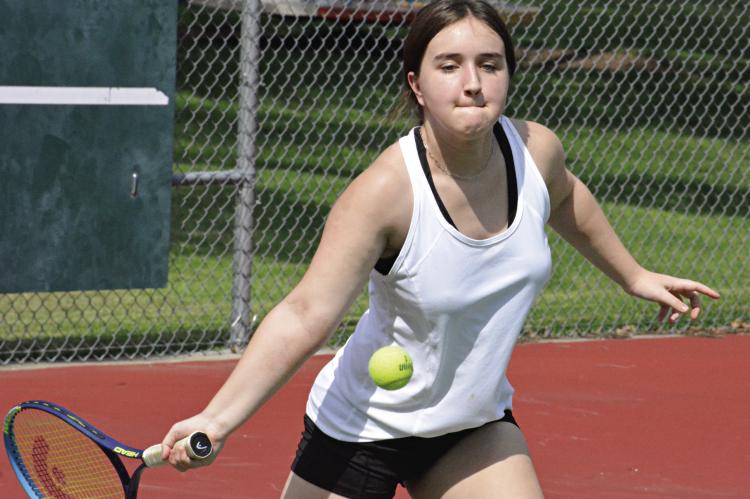 RICHMOND JUNIOR Raegan Alderson keeps her eyes on the ball as she works on her baseline return shots Aug. 10 at Maurice Roberts Park. SHAWN RONEY | Staff