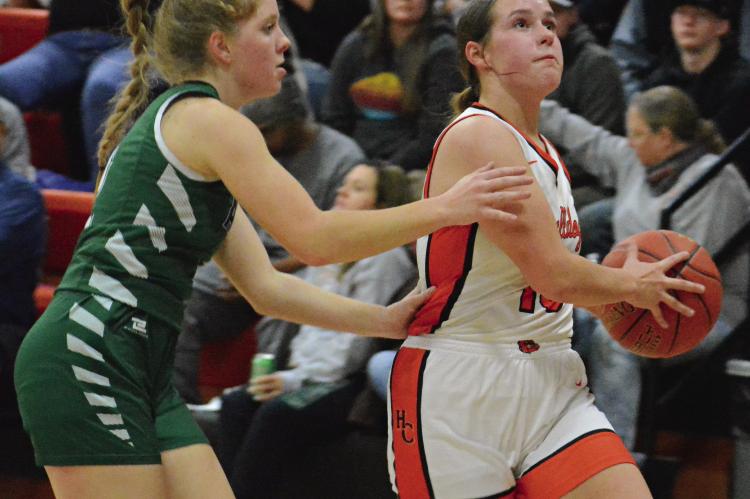 SENIOR ADDISON SCHACHTELE (right) eyes the basket as she drives toward the hoop for Hardin-Central against Tina-Avalon. SHAWN RONEY | Staff