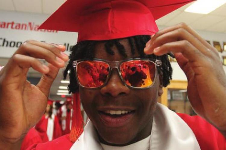 READY for the sun outside, Jacoby Johnson puts on his shades inside the school.