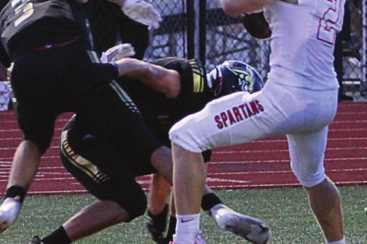 SENIOR Evan Vandiver’s sideline work gets the Spartans 20 yards and inside Lathrop’s 5-yard line.