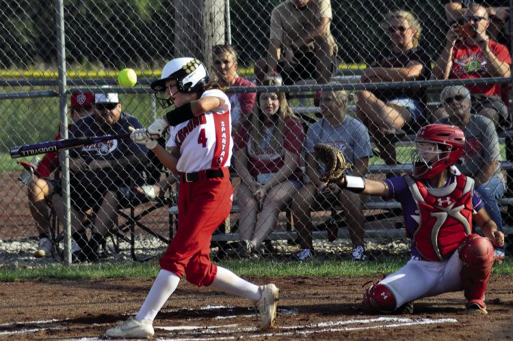 DID SYDNEY APPLEBERRY (left) have walkout music before at-bats like this one when she played high school softball at Richmond in front of her hometown fans? If not, a snippet of hip-hop might’ve fit the bill. SHAWN RONEY | Staff