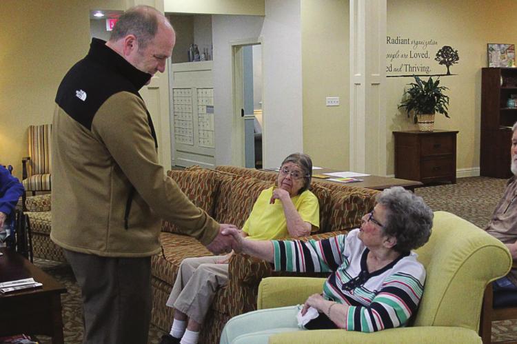 STATE SEN. Denny Hoskins visits with Bonnie George and other residents at Oak Ridge Assisted Living and Memory Care, 803 Crispin St., Richmond, about a variety of issues during his facility tour earlier this year. Now, such visits would be rejected due to the need to avoid spreading the coronavirus. J.C. VENTIMIGLIA | Staff