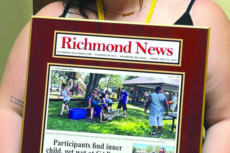 SOPHIA BALES SHOWS the plaque made to be displayed in the Special Needs Services new building. CASSIE HOBECK | Submitted