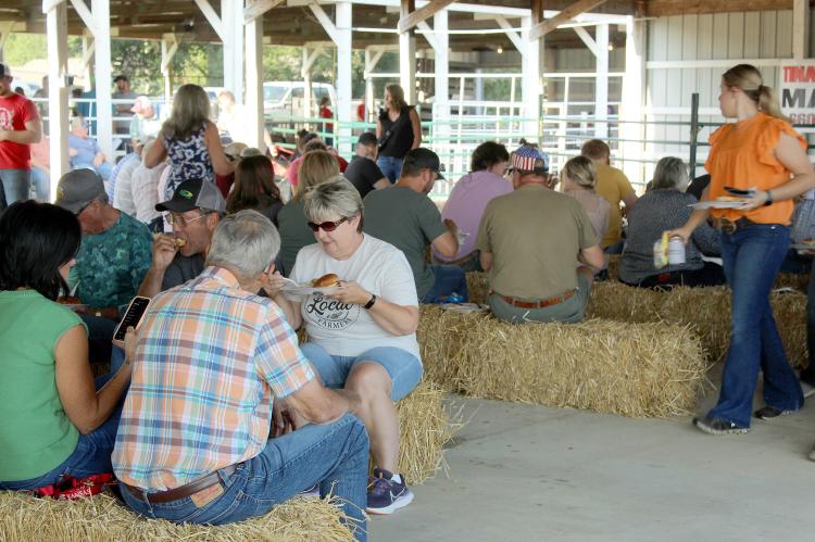 BRENDA HAMM (center) enjoys the Farmers Appreciation Dinner with other attendees. SHARON DONAT | Staff