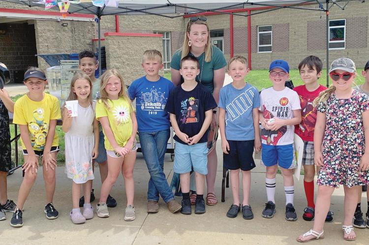 ALAZE CHOWNING and her class of second-grade summer school students run a lemonade stand at Sunrise Elementary, learning entrepreneurial skills and donating their profits to the school’s backpack program.