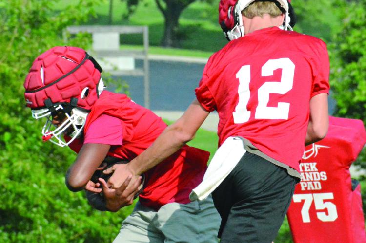 JUNIORS CHRIS WEBB (left) and Jacob Johnson are among the skill position players who are taking on starting roles this season for Richmond in varsity 11-man football. SHAWN RONEY | Staff
