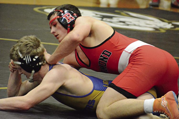 WRESTLING IN the top position, Richmond senior Elijah Sanders maintains control of Lafayette County’s Braxton Ernst during their 165-pound championship title match Feb. 3 at the Lathrop Invitational. SHAWN RONEY | Staff