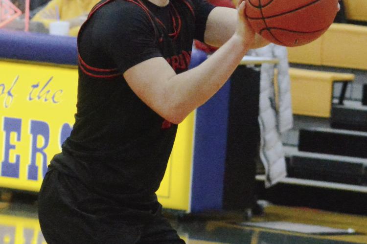 RICHMOND SOPHOMORE Dryden Hendrix shoots a slew of free throws resulting from multiple technical fouls called against Lafayette County of Higginsville late in the Husker Classic title tilt. SHAWN RONEY | Staff