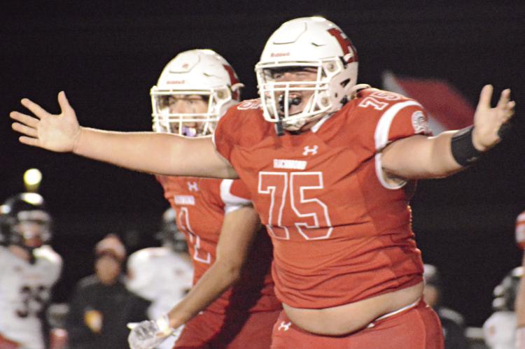 WITH HIS arms spread, Richmond senior Jake Cringan is ready for bro hugs after his third-quarter interception Oct. 13 against visiting Knob Noster. SHAWN RONEY | Staff