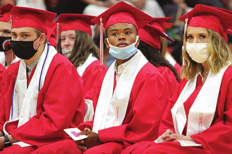 AMONG THE GRADUATES, at center, is Adrian Church. A transfer senior, Church leaves his mark on Richmond High School in several ways, including as an outstanding football player and a track star.