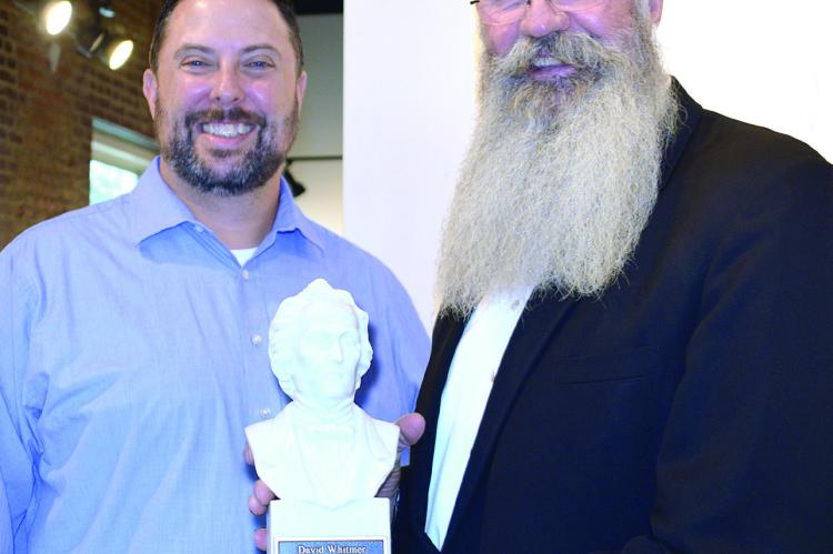 JIMMY CARTER, the 2019 recipient, presents Art Endsley with the 2022 David Whitmer Service Award on Sept. 10 at the Farris Theatre. Submitted
