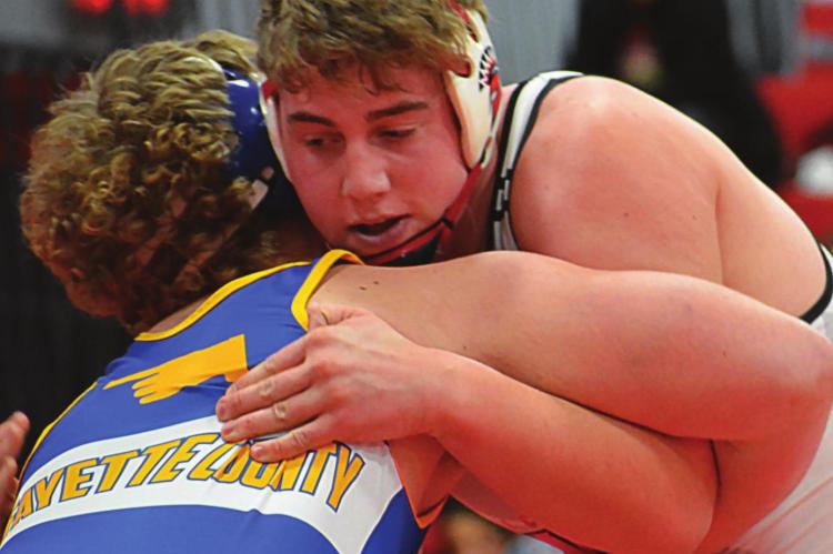 ZANE RENFRO, Richmond senior and 2022 mat king, grapples during the Spartans’ Jan. 27 triangular with Lafayette County of Higginsville and Polo. SHAWN RONEY | Staff