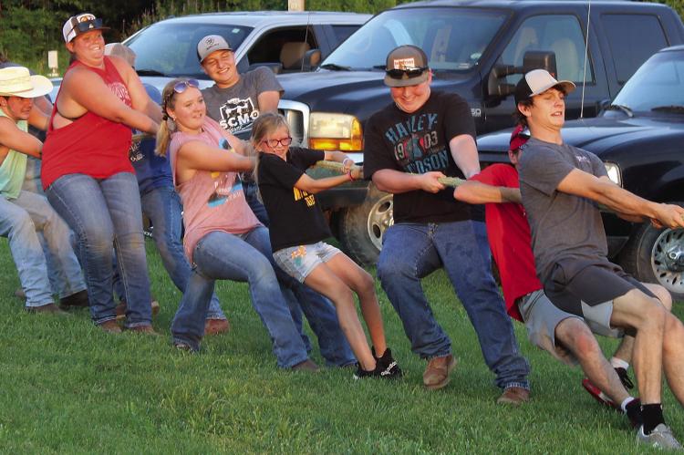 SHARON DONAT | Staff ORRICK AND HARDIN FFA Chapters struggle against the Richmond FFA chapter in a tug -o-war.