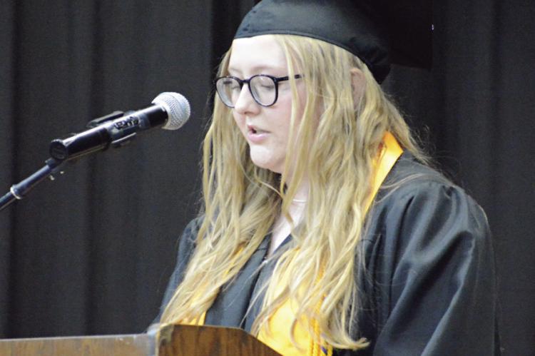 EMMA TRUE, one of two Latin honor student speakers, addresses her fellow graduates and the crowd.