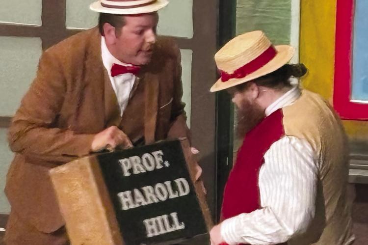 RYAN KUGLER (left), staring as Professor Harold Hill, is joined onstage by Scott Arnett. JOSHUA BRUNGARDT | Staff