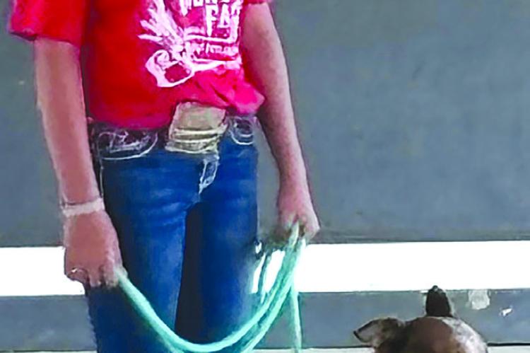 JOSHUA BRUNGARDT | Staff CHEYANNE LORINO shows off her dog.