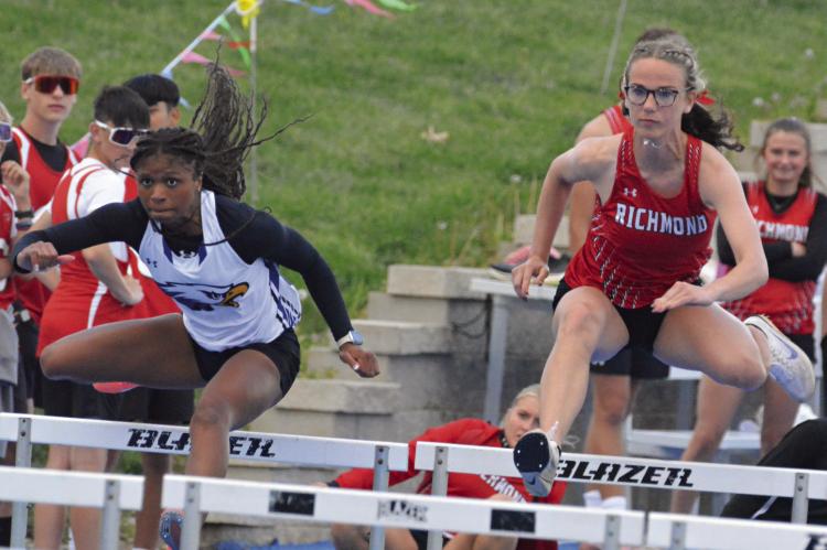 SOON-TO-BE Richmond graduate Kaylee King (right) fights for the lead early in the varsity girls 100-meter high hurdles at the Missouri River Valley Conference-East Division meet. SHAWN RONEY | Staff