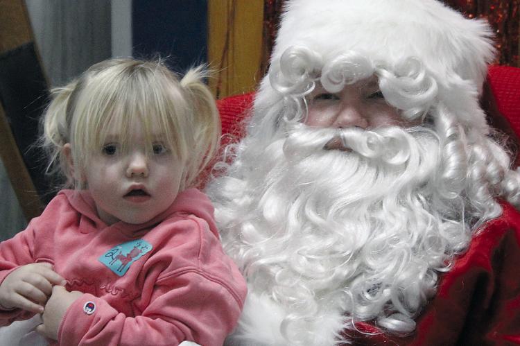 TINSLEY SHANNON takes advantage of her time with Santa by sharing what she wants for Christmas. SHARON DONAT | Staff