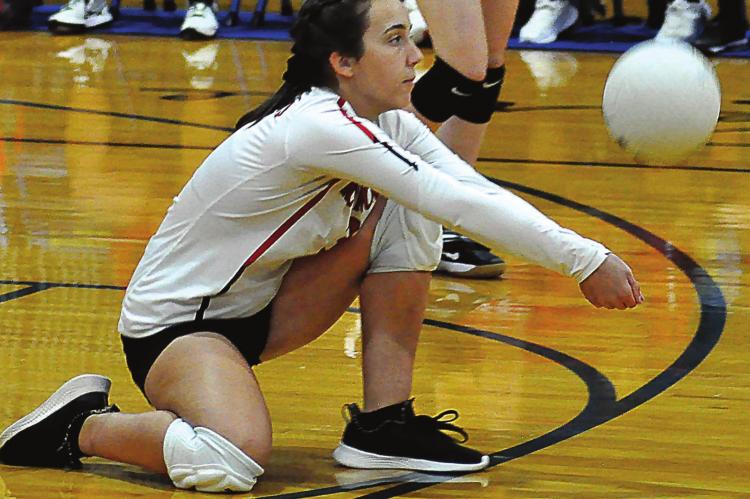 PLAYING LIBERO, senior Savannah Brungardt digs the ball during the first set of Richmond’s bracket-play match with Versailles at the Husker Spikefest on Sept. 11 at Lafayette County of Higginsville. SHAWN RONEY | Staff