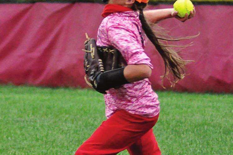 RICHMOND SOPHOMORE Trinidy Fisk heaves the ball from right field to help the Spartans protect their shutout Tuesday at Southview Park.SHAWN RONEY | Staff
