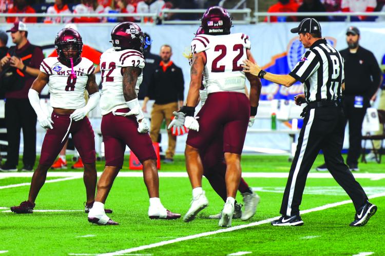 BECAUSE OF Keyshaun Elliott (No. 22), this year’s Quick Lane Bowl has a lasting connection to Ray County. But it isn’t the only bowl game this season with a special connection to Ray County — at least not for a certain sports editor. ASHLEIGH RANDAZZO | New Mexico State Athletics