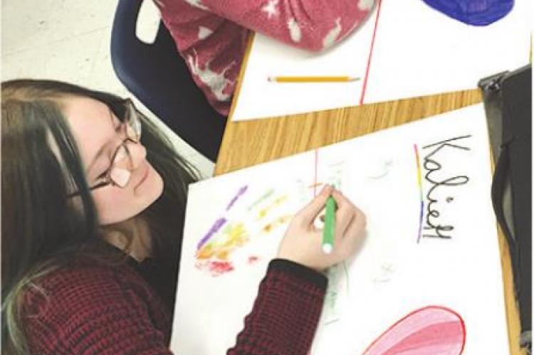 WORKING on their selfdescription posters are Gabby Johnson and Kalie Hendrix.