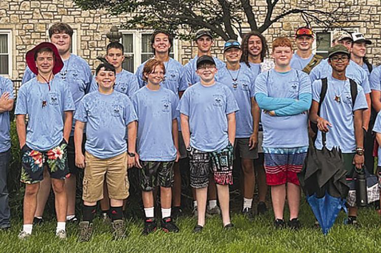 BOY SCOUT TROOP #324 and leaders gather at the United Methodist Church to travel to Boy Scout camp. Submitted