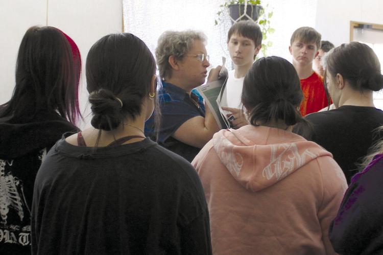 RICHMOND HIGH SCHOOL Work Force Math teacher Renee Seba shows students delinquent property tax list in the Richmond News. SHARON DONAT | Staff