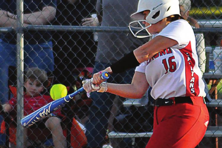 ALEANA McFEE fights off a pitch during the third inning of Richmond’s meeting with Cameron on Monday at Southview Park. McFee and her fellow Spartans rally to win 3-1, extending their winning streak to five games. SHAWN RONEy | Staff
