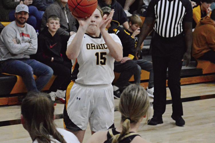 ALL EYES, or at least many eyes, are upon senior Natasha Hicks as she shoots during the first half of Orrick’s Jan. 5 meeting with visiting Norborne in varsity girls basketball. SHAWN RONEY | Staff
