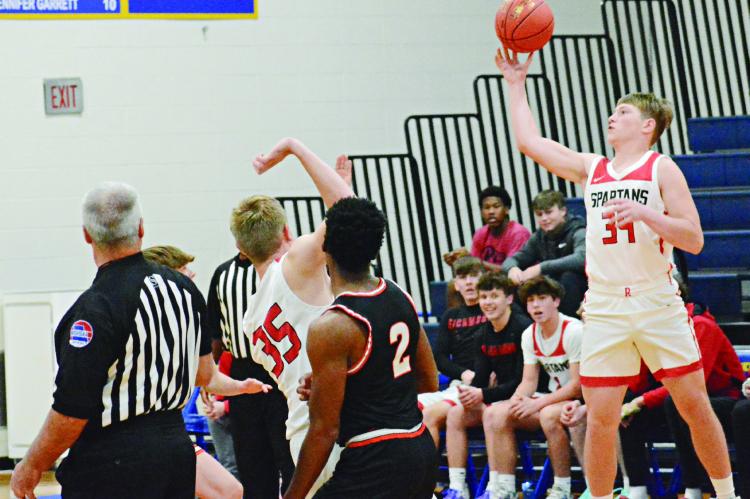 FIVE QUARTERS before grabbing Richmond’s game-sealing rebound against Oak Grove Dec. 9 at the Husker Classic in Higginsville, junior Tristan McCoy reaches for the opening tipoff. SHAWN RONEY | Staff