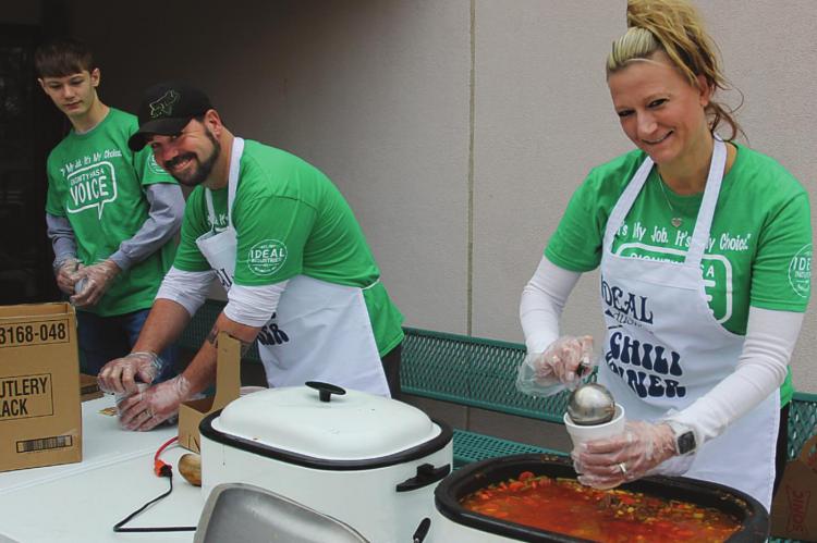 IN ADDITION to ladling out to-go cups of chili and soup at Ideal’s annual fundraiser, the Baker family advocates for maintaining Missouri’s comparative-work system for paying sheltered workshop employees. From left are Gabriel, Gabe and Donna Baker. J.C. VENTIMIGLIA | Staff