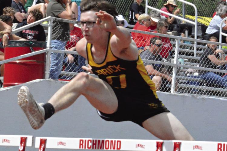 JONATHON HARRIS, shown running the hurdles in 2023 in Richmond, is the first state champion during Kirk Thacker’s tenure as a varsity track coach. SHAWN RONEY | Staff