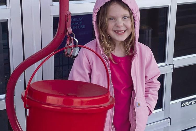 Lillian Opfer was one of a dozen members of the Guys and Gals club ringing the bell for Salvation Army. Submitted