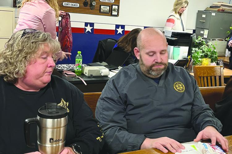 PENNY LEE AND Ray County Sheriff Scott Childers attend the recent Ray County Commission meeting regarding miscommunication among local agencies. SOPHIA BALES | Staff